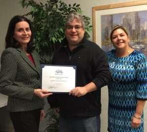 Eric LaFleur accepts the award from Jean McCann, Pentucket Bank, Chairman of the Member Services Committee and Kelley Contarino, Align Credit Union, and Committee Member